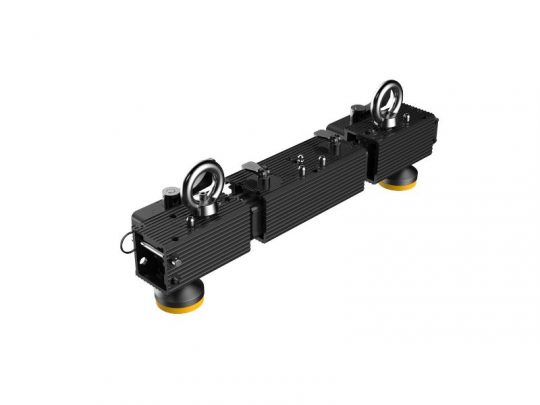 The Unilumin Stacking - URMIII 2.6 MK2 Pro 2in1 Bracket XS 0.5m, available for rent, features two rectangular black units connected by a central bar. Each unit has a metal ring on top and yellow-rimmed suction cups underneath, designed for secure mounting and stacking purposes.