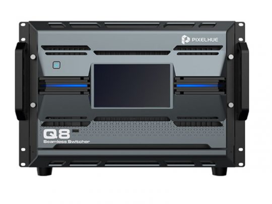 Front view of the PIXELHUE Q8 Seamless Switcher, a new large black and gray professional AV device with sturdy side handles, multiple ventilation slots, a central touchscreen display, and control buttons for easy operation.