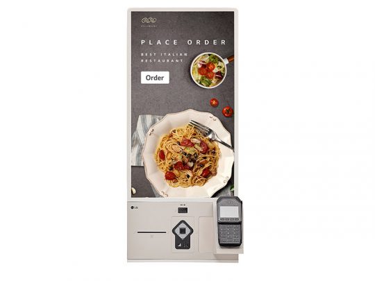 Touchscreen kiosk at Best Italian Restaurant displaying a pasta dish and salad with the message Place Order and an Order button; payment terminal and card reader are positioned below for easy checkout.