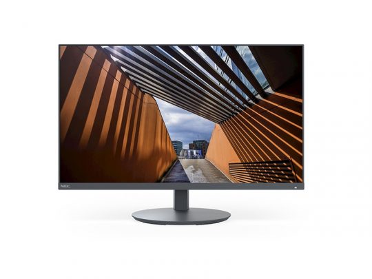Slim modern computer monitor (possibly Dell or HP) displaying a vivid architectural scene with bright orange walls, slatted roof creating striped shadows, and an open walkway extending toward a cloudy sky. Perfect desktop display for design professionals.
