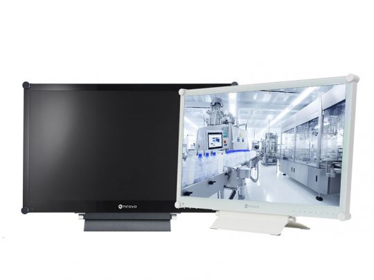 Two computer monitors side by side; the left monitor is turned off with a blank black screen, and the right monitor is on, showing a bright industrial factory or laboratory environment. Ideal dual-monitor setup for office or industrial workstation.